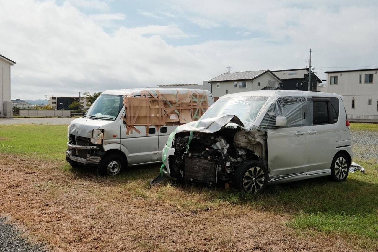 Damaged vehicles after a roadway collision